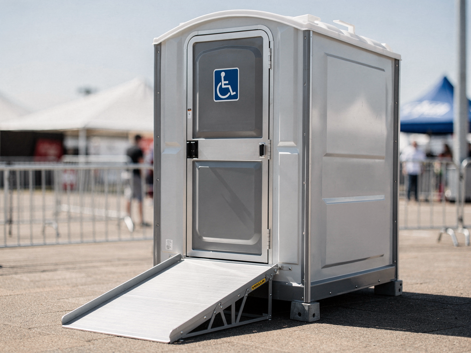 ADA-compliant portable toilet with wider door and ramp access